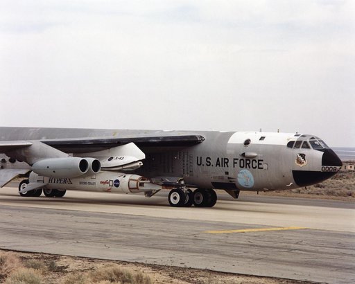 NASA's NB-52B carrier aircraft rolls down a taxiway with the X-43A hypersonic research aircraft and its modified Pegasus® booster rocket attached to a pylon under its right wing.