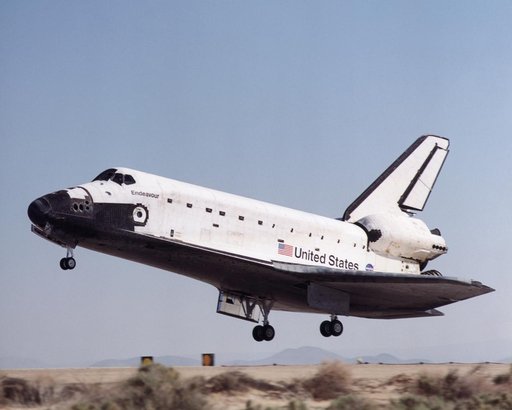 Space Shuttle Endeavour flares for landing at Edwards Air Force Base, California to conclude STS-100