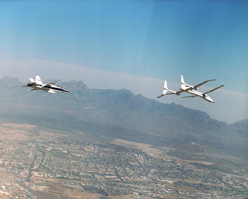 Scaled Composites' Proteus and an F/A-18 Hornet from NASA's Dryden Flight Research Center are seen here in flight over Las Cruces, New Mexico.