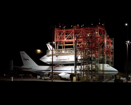 The Space Shuttle Endeavour receives post-flight servicing in the Mate-Demate Device (MDD), following its landing at NASA's Dryden Flight Research Center, Edwards, California, June 19, 2002