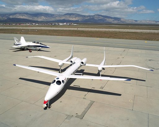 Scaled Composites' Proteus aircraft and an F/A-18 Hornet from NASA's Dryden Flight Research Center at Mojave Airport in Southern California.