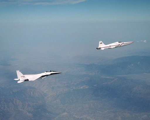 NASA's F-15B research testbed jet from the NASA Dryden Flight Research Center flew in the supersonic shockwave of a Northrop Grumman Corp. modified F-5E in support of the Shaped Sonic Boom Demonstration (SSBD) project, which is part of DARPA's Quiet Supers