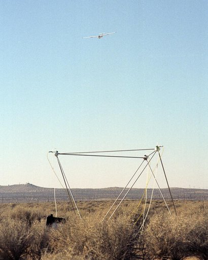 A Blanik L-23 glider carrying a microphone and a pressure transducer flies near a BADS sensor following flight under the path of the F-5E SSBE aircraft