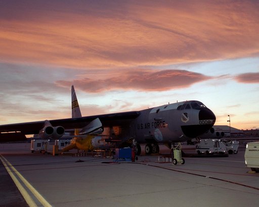 NASA's B-52B launch aircraft at sunset with the second X-43A hypersonic research vehicle attached to a modified Pegasus rocket under its right wing