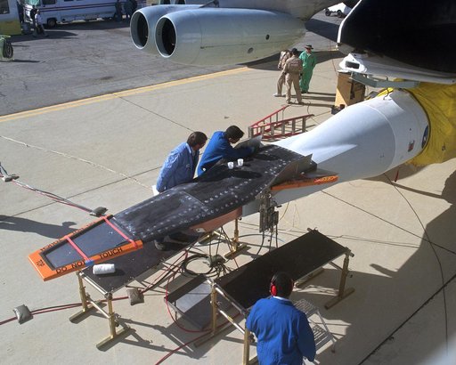 The second X-43A hypersonic research vehicle, mounted under the right wing of the B-52B launch aircraft, viewed from the B-52 cockpit