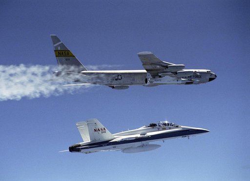 NASA's B-52B launch aircraft cruises to a test range over the Pacific Ocean carrying the second X-43A vehicle attached to a Pegasus rocket on March 27, 2004