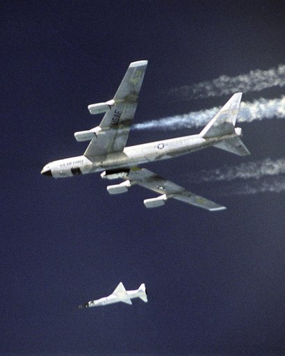 A modified Pegasus rocket drops steadily away after release from NASA's B-52B, before accelerating the X-43A over the Pacific Ocean on March 27, 2004
