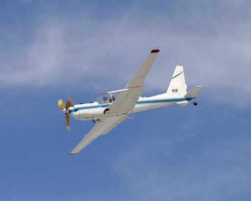 The slow-speed wooden propeller and long wings are evident as NASA's YO-3A acoustics research aircraft performs a low-level flyover at Edwards Air Force Base