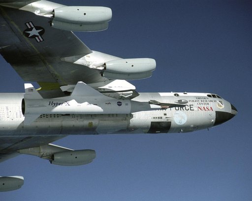 NASA's B-52B launch aircraft cruises to a test range over the Pacific Ocean carrying the third X-43A vehicle attached to a Pegasus rocket on November 16, 2004