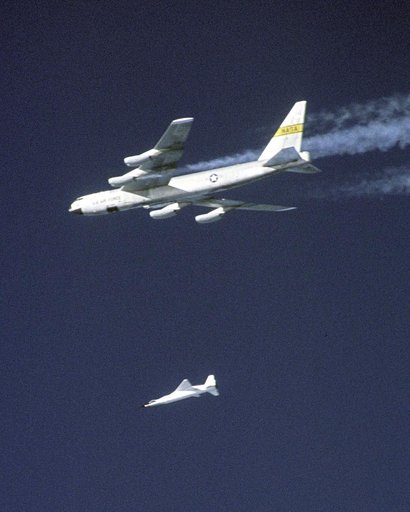 A modified Pegasus rocket drops away after release from NASA's B-52B before accelerating the X-43A over a Pacific Ocean test range on Nov. 16, 2004