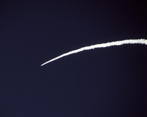The Pegasus rocket that powered NASA's X-43A scramjet to almost Mach 10 test conditions leaves a bright arc in the Pacific sky during the boost phase