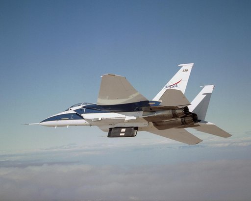 Two panels of Space Shuttle TPS insulation were mounted on the flight test fixture underneath NASA's F-15B during the Lifting Foam Trajectory flight test series