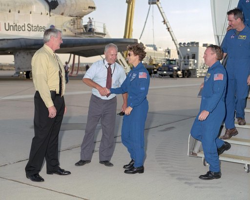 NASA DFRC Deputy Director Steven Schmidt and DFRC Shuttle Program Manager Joe D'Agostino greet Commander Eileen Collins and the crew of STS-114