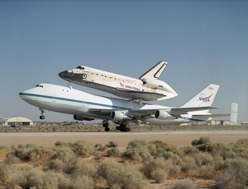NASA's 747 Shuttle Carrier Aircraft with the Space Shuttle Discovery on top lifts off to begin its ferry flight back to the Kennedy Space Center in Florida