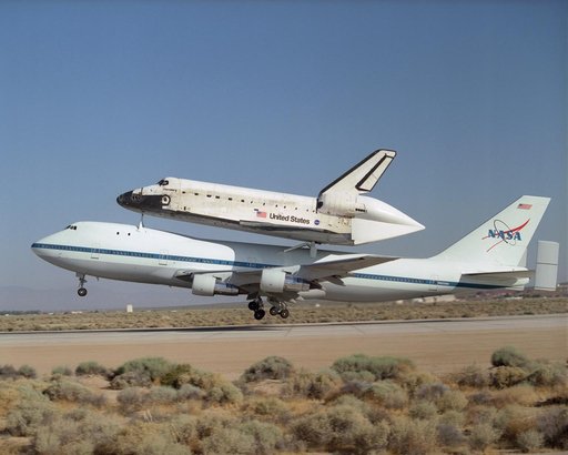 NASA's 747 Shuttle Carrier Aircraft with the Space Shuttle Discovery on top lifts off to begin its ferry flight back to the Kennedy Space Center in Florida