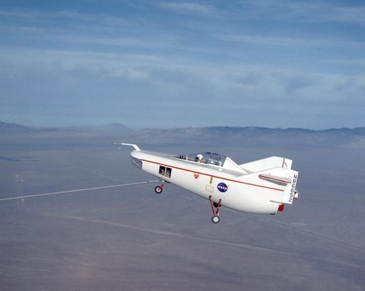 M2-F1 in flight over lakebed on tow line