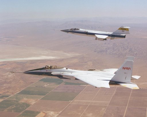 F-15 #281 and F-104 #826 fly in formation during Space Shuttle tile testing.