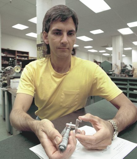 Dryden-built surgical suture instrument