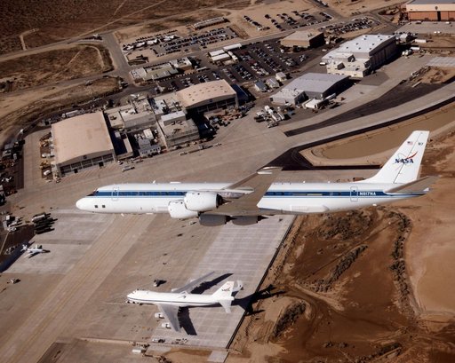 DC-8 Airborne Laboratory in flight over NASA Dryden center with SCA 747 on ramp