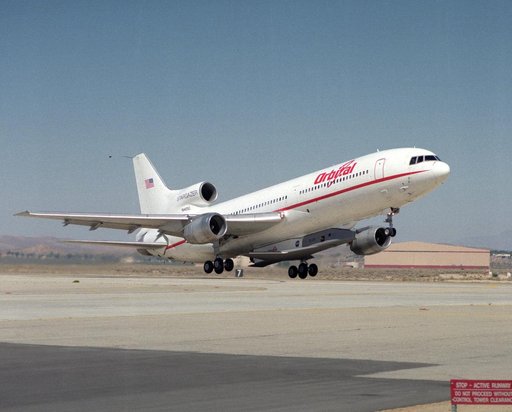 X-34 mated to modified L-1011 during takeoff on first captive carry flight