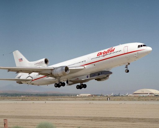 X-34 mated to modified L-1011 during takeoff on first captive carry flight