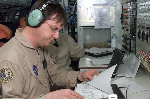 David Bushman at the Mission Manager's console onboard NASA's DC-8 during the AirSAR 2004 campaign