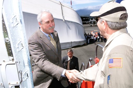 Dr. Tom Mace, DFRC Director of Airborne Sciences, greets NASA Administrator Sean O'Keefe as he enters the DC-8 aircraft during a stop-off on the AirSAR 2004 campaign