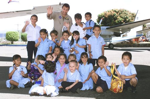 NASA Dryden Mission Manager Walter Klein poses with school children that visited the airport during AirSAR 2004