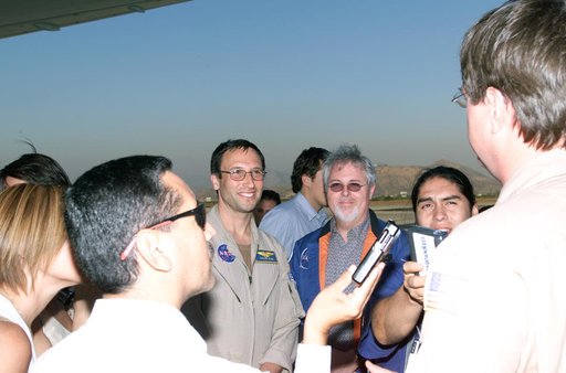 L to R; Walter Klein (in tan flight suit), Tim Miller, and David Bushman briefing press in Santiago, Chile, for NASA's AirSAR 2004 mission