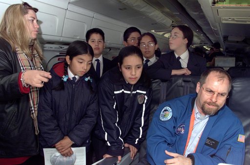 School children from Punta Arenas, Chile, talk with Dr. David Imel, an AirSAR scientist from NASA JPL, during AirSAR 2004