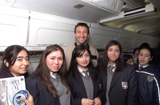 NASA Dryden Mission Manager Walter Klein poses with school children that visited the DC-8 during AirSAR 2004 in Punta Arenas, Chile