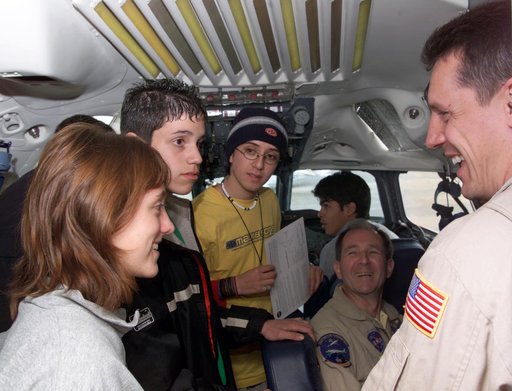 NASA DC-8 Pilots Craig Bomben and Bill Brockett explain the DC-8 cockpit to Chilean students onboard the DC-8 aircraft in Punta Arenas, Chile