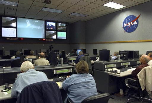 NASA engineers monitor mission progress from a Dryden control room prior to launch of the X-43A scramjet and its booster from NASA's B-52B mothership