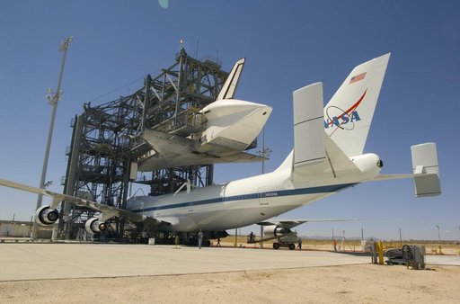 NASA's modified 747 Shuttle Carrier Aircraft is positioned under the Space Shuttle Discovery to be attached for their ferry flight to the Kennedy Space Center