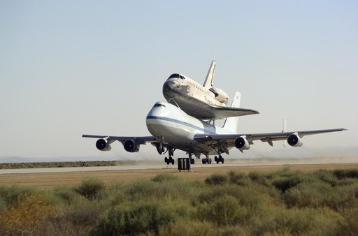 NASA's 747 Shuttle Carrier Aircraft with the Space Shuttle Discovery on top lifts off to begin its ferry flight back to the Kennedy Space Center in Florida
