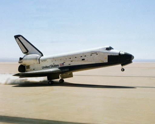 The Space Shuttle Columbia touches down on lakebed runway 23 at Edwards Air Force Base, Calif., to conclude the first orbital shuttle mission