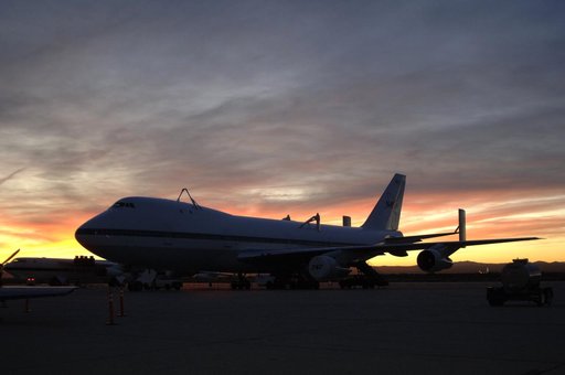 One of NASA's two modified Boeing 747 Shuttle Carrier Aircraft is silhouetted against the morning sky at sunrise on the ramp at Edwards Air Force Base