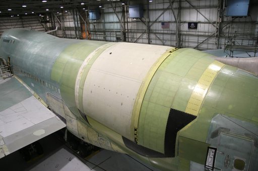 A rotating external door (white) was installed over the telescope cavity in the rear fuselage of NASA's SOFIA Boeing 747SP during modifications in Waco, Texas