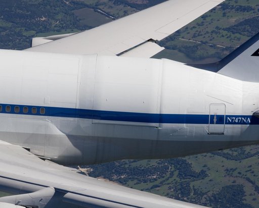 NASA's SOFIA 747SP shows evidence of modification to its aft fuselage contours to accommodate a 16-foot-tall cavity door for its 45,000-pound infrared telescope