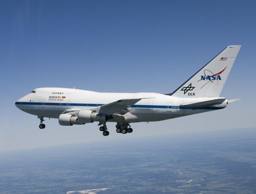 With landing gear extended, the NASA/DLR Stratospheric Observatory for Infared Astronomy (SOFIA) 747SP cruises over central Texas on its first checkout flight