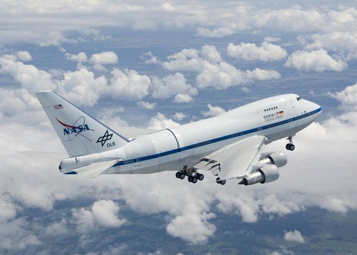 NASA's Boeing 747SP SOFIA airborne observatory soars over a bed of puffy clouds during its second checkout flight over the Texas countryside on May 10, 2007