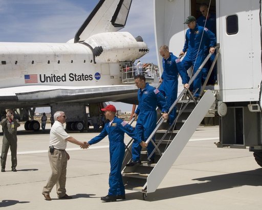 DFRC Center Director Kevin Petersen greets Commander Frederick Sturckow and the crew of the Space Shuttle Atlantis at Edwards, AFB, Calif., on June 22, 2007