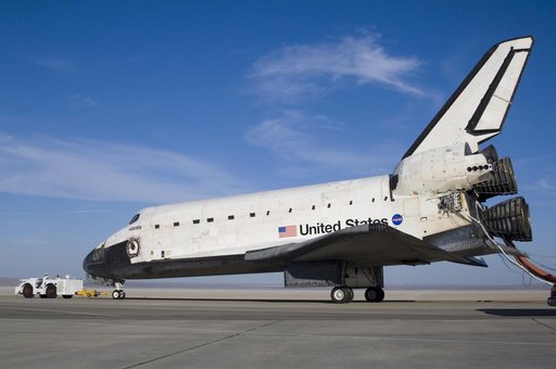 The Space Shuttle Atlantis is towed from the runway at Edwards Air Force Base to NASA Dryden's Mate-Demate Device (MDD) for post-flight processing