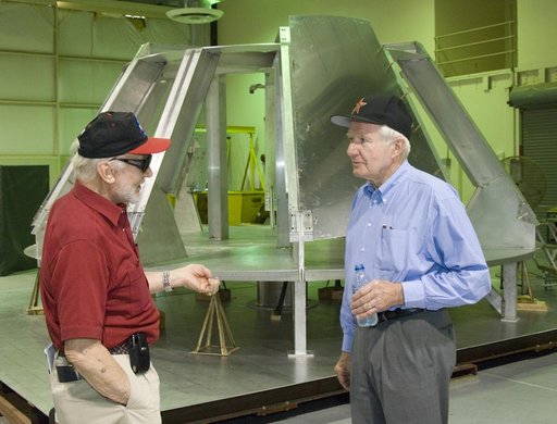 Apollo 11 astronaut Buzz Aldrin (left) and Apollo-Soyuz and space shuttle astronaut Vance Brand discuss Dryden's work on an Orion fit-check crew module mockup