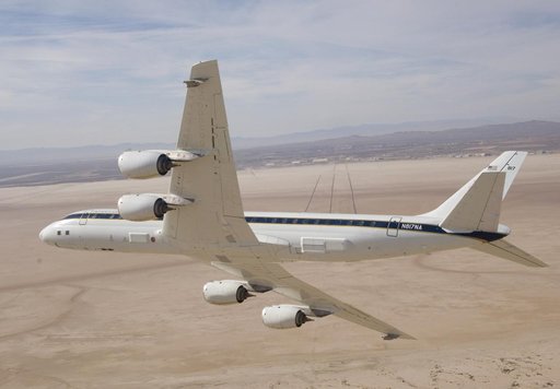 NASA's DC-8 airborne science laboratory banks low over Rogers Dry Lake at Edwards Air Force upon its return to NASA Dryden Flight Research Center Nov. 8, 2007