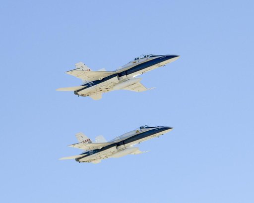 Two NASA Dryden F/A-18s flown by Gordon Fullerton and Nils Larson fly in tight formation Dec. 21, 2007 during Fullerton's final flight before his retirement.