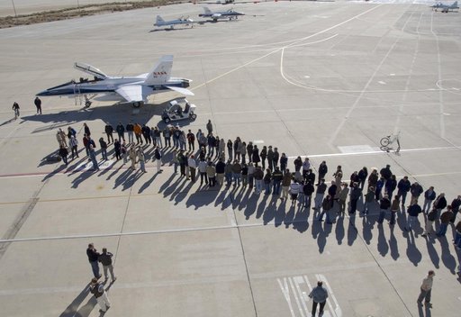 More than 200 Dryden staff formed two long lines on the Dryden ramp to greet retired research pilot Gordon Fullerton after his final flight in a NASA F/A-18.