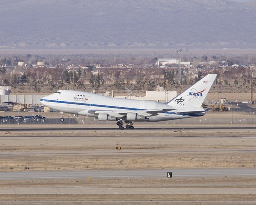 NASA's SOFIA infrared observatory touches down at Air Force Plant 42 in Palmdale, CA, as it arrives at its new home, the Dryden Aircraft Operations Facility