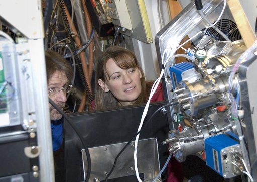 Chris Cantrell and Becky Anderson of the National Center for Atmospheric Research assess the CIMS instrument's operation during ARCTAS mission preparations