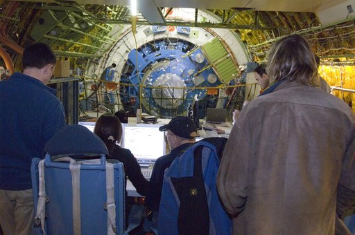 As SOFIA's large telescope assembly slowly rotates, scientists and telescope operators review data readouts and imagery on their monitors during tracking tests